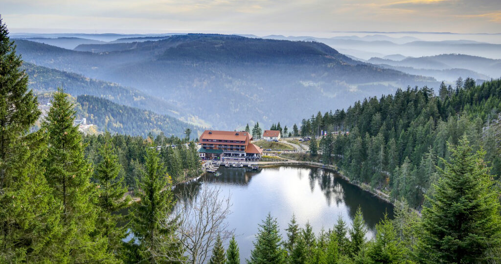 View of Mummelsee and mountain peaks in Black Forest Germany