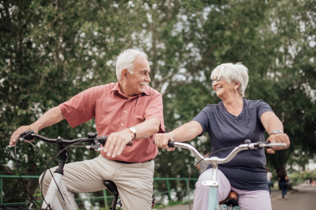 Old couple riding a bike